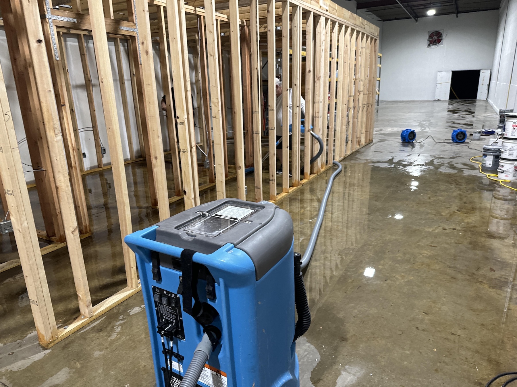 Commercial framing exposed and saturated after storm intrusion in Indianapolis